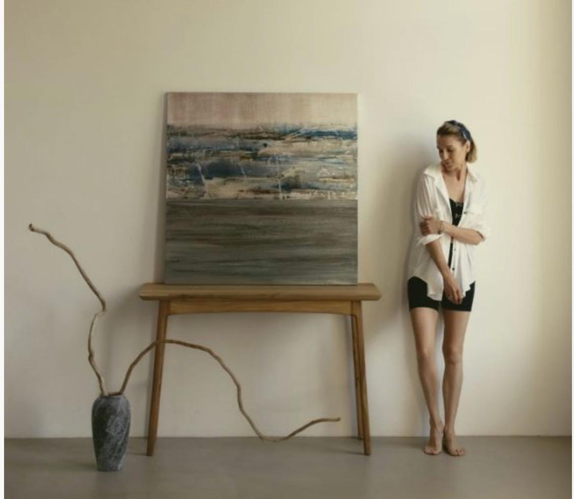Lida Stoliarova beside her artwork